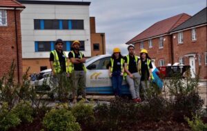 Facilco team in front of a Facilco vehicle