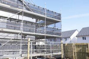 Large building under construction with scaffolding