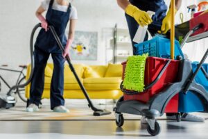 Cleaning team vacuuming and polishing