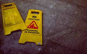 Caution - cleaning in progress signs on the floor