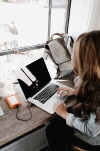 Student looking at laptop in student accommodation